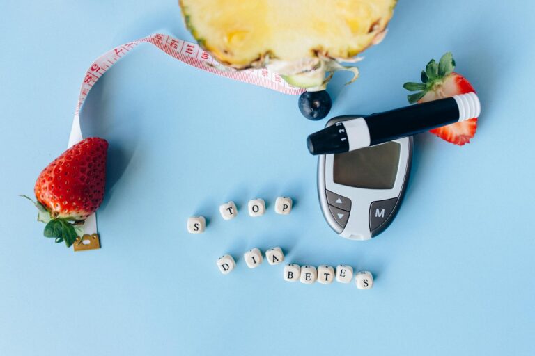 Conceptual flat lay with fruits, glucose meter, and message for diabetes prevention.